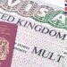 A picture of a UK multi visa stamped on a passports