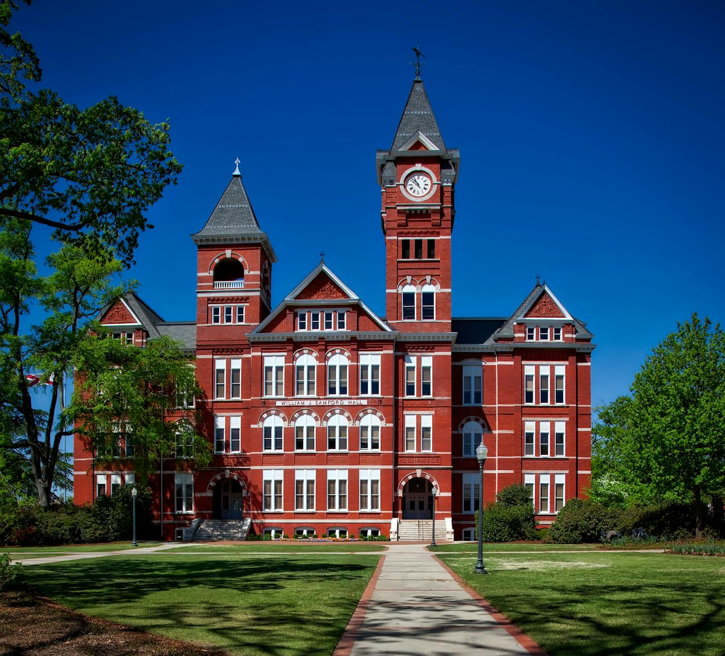 A UK university building with the a clock on top