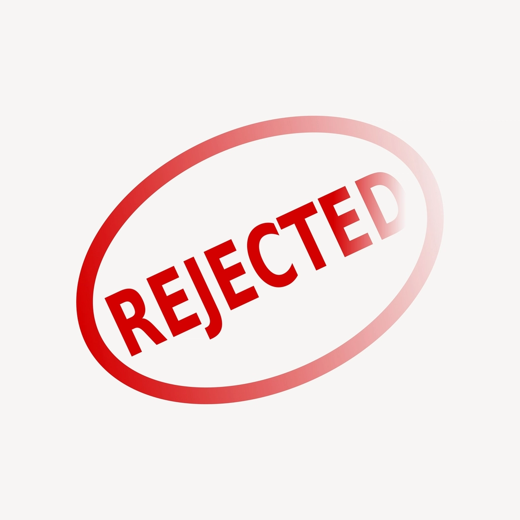 'Rejected' printed on the screen. This is portraying visa rejection for international students applying to the UK. 