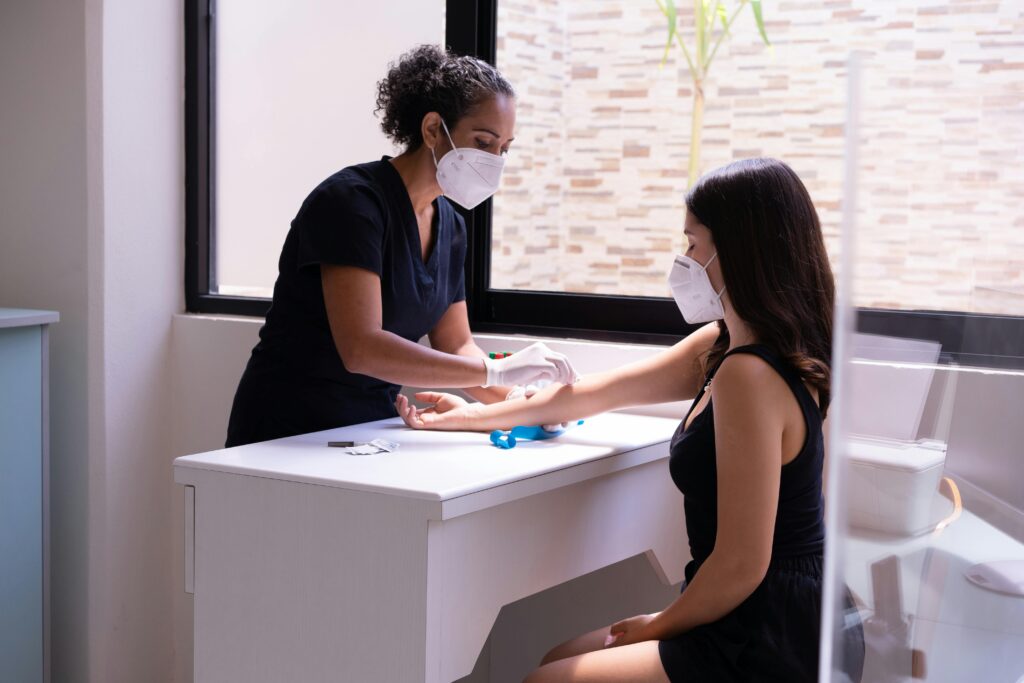 UK Nurse attending to a patient