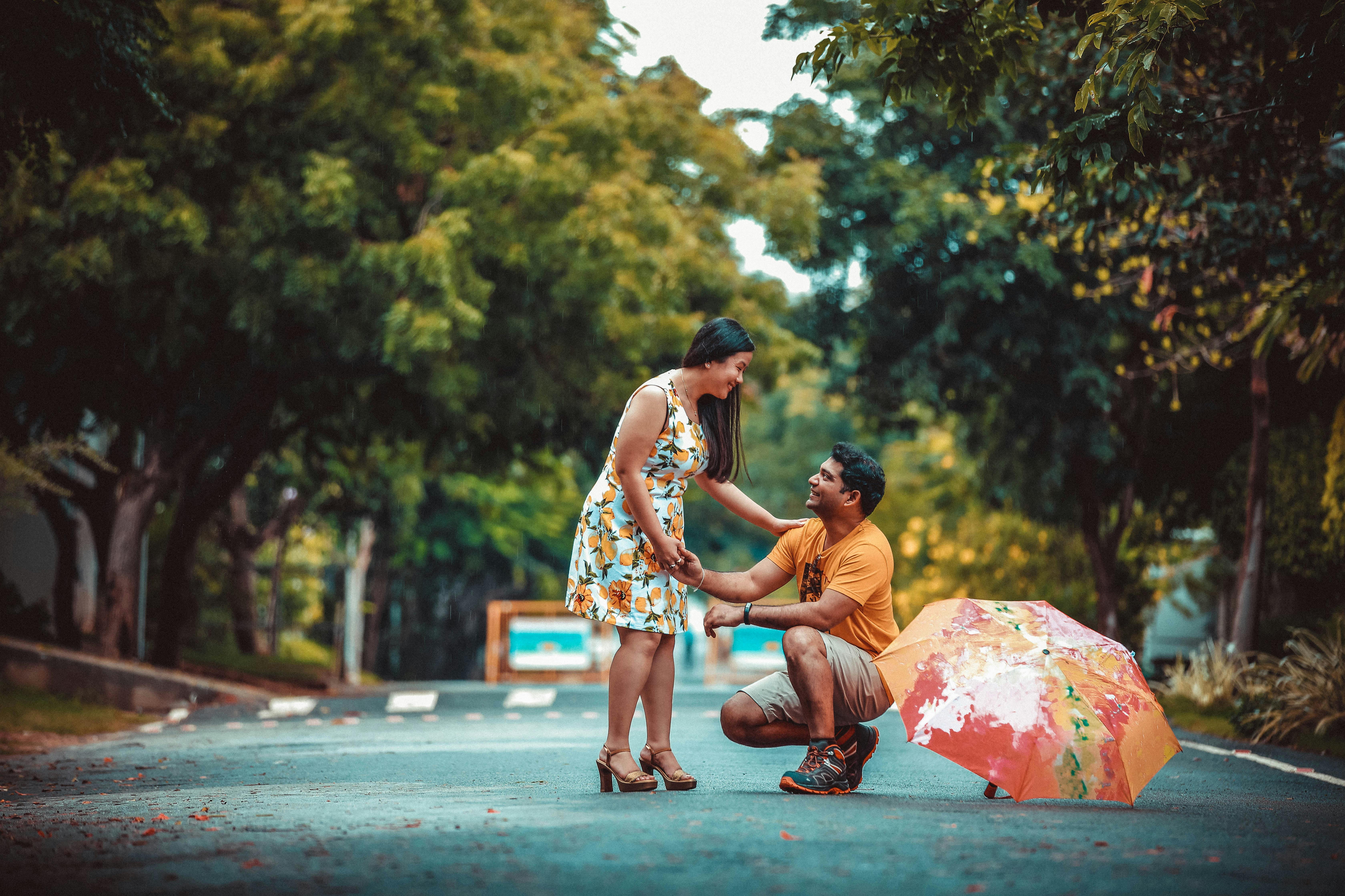 a couple proposal at a park