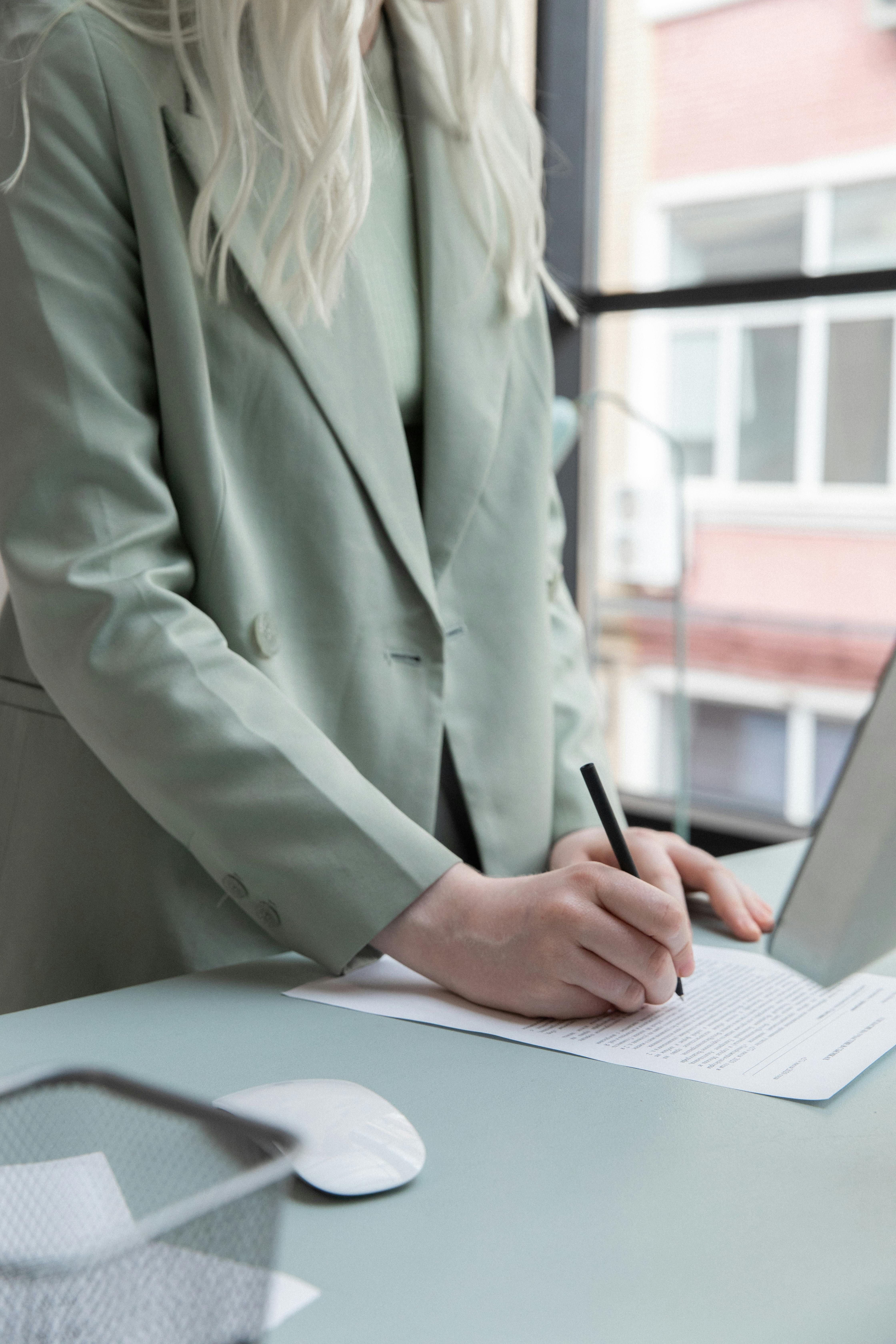 A woman writing on paper