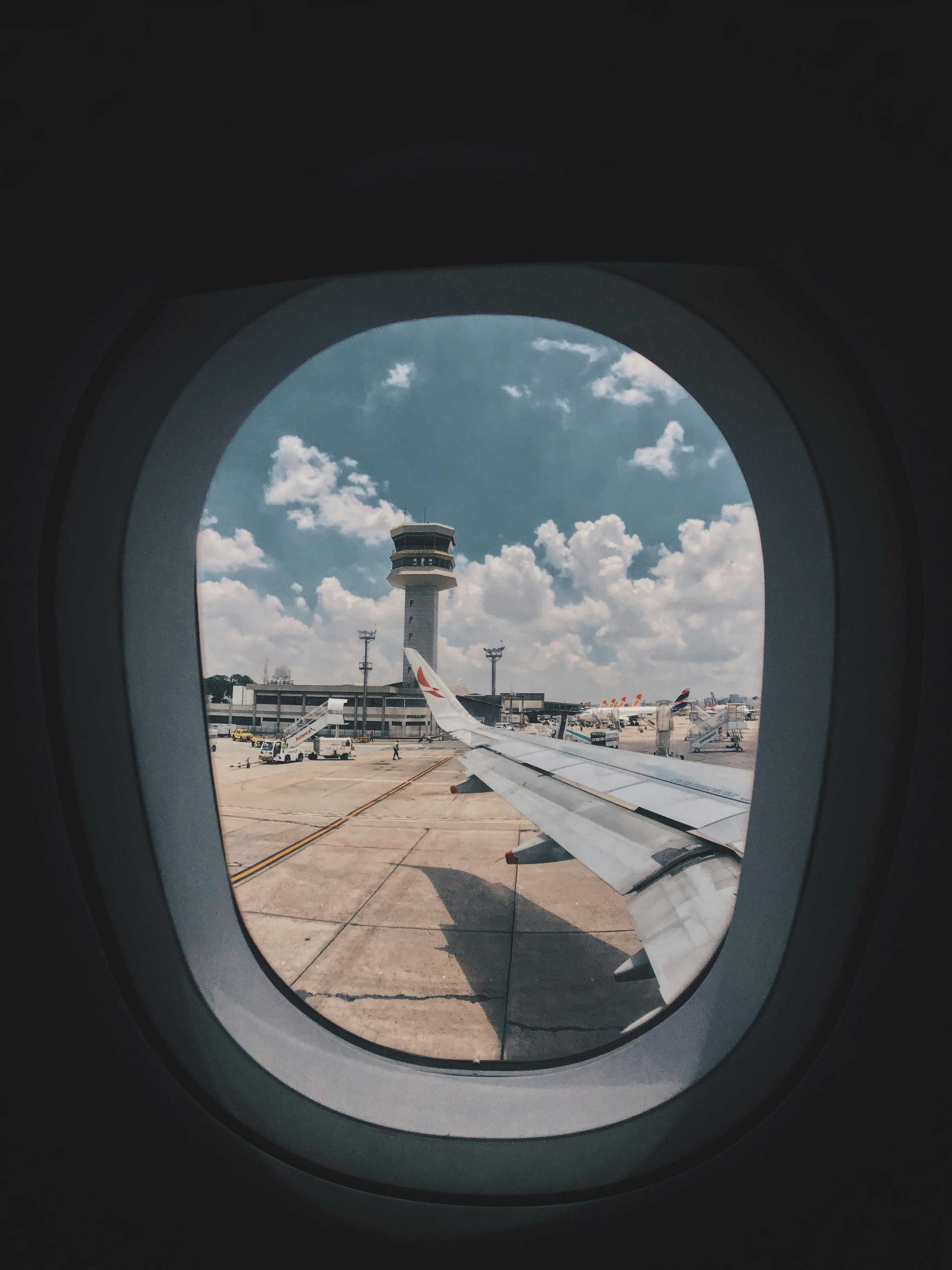 A view of the wing of an airplane through the window