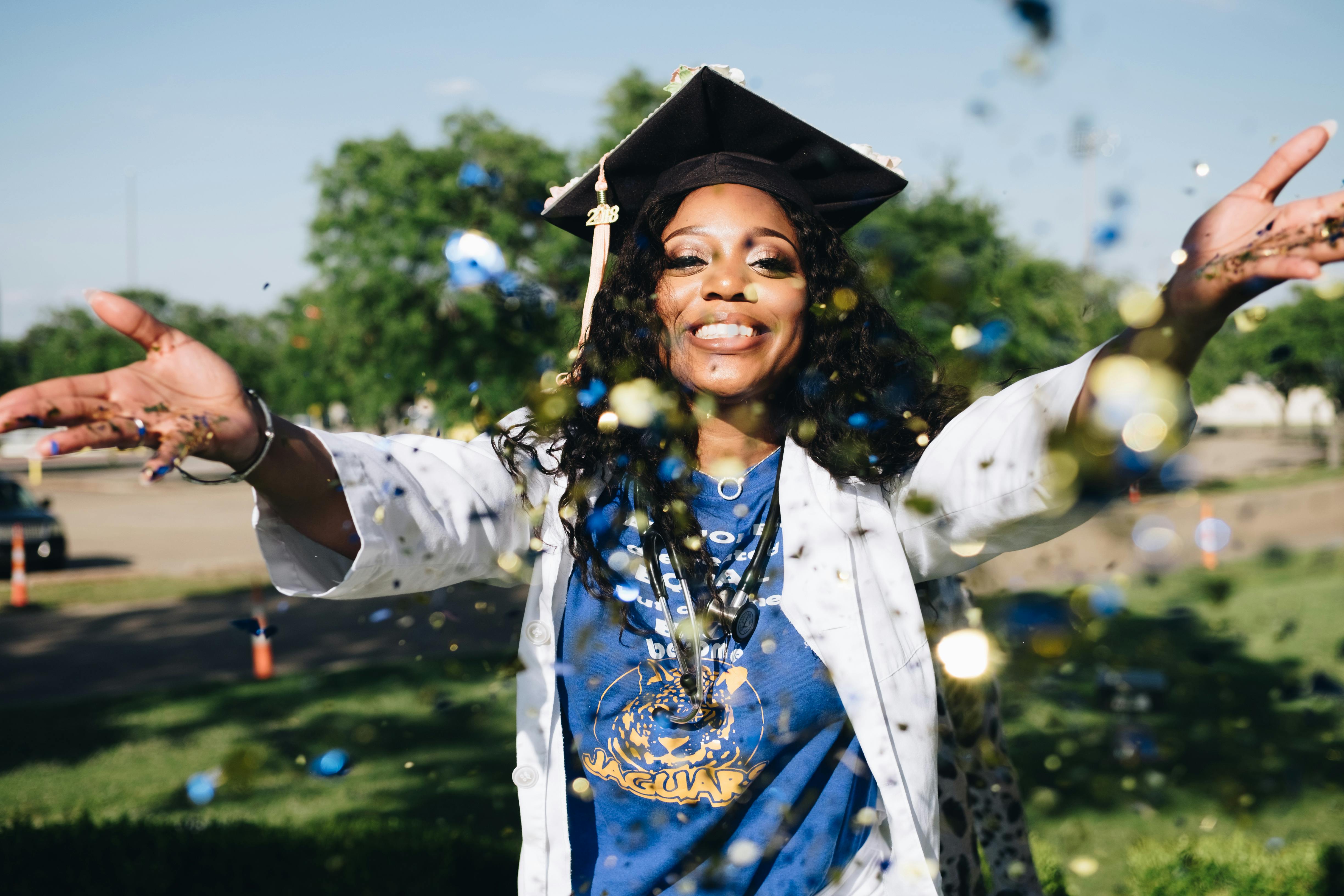 A student nurse celebrating upon graduation