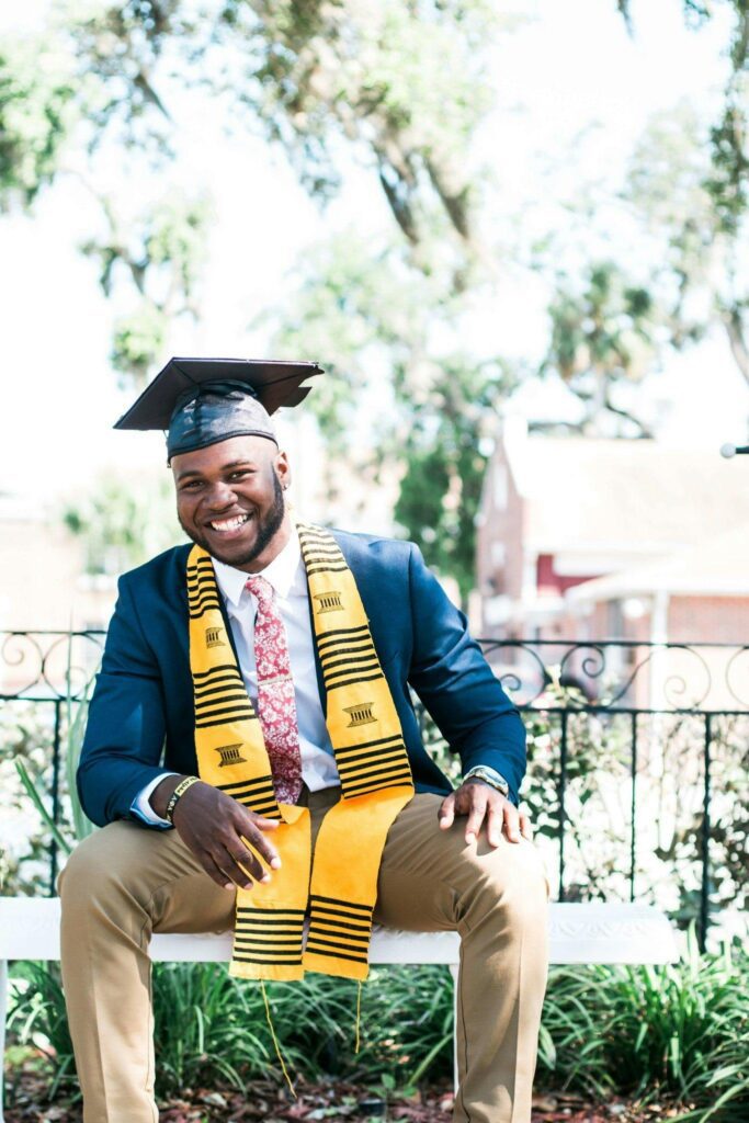 A student all smiles upon graduation from the UK