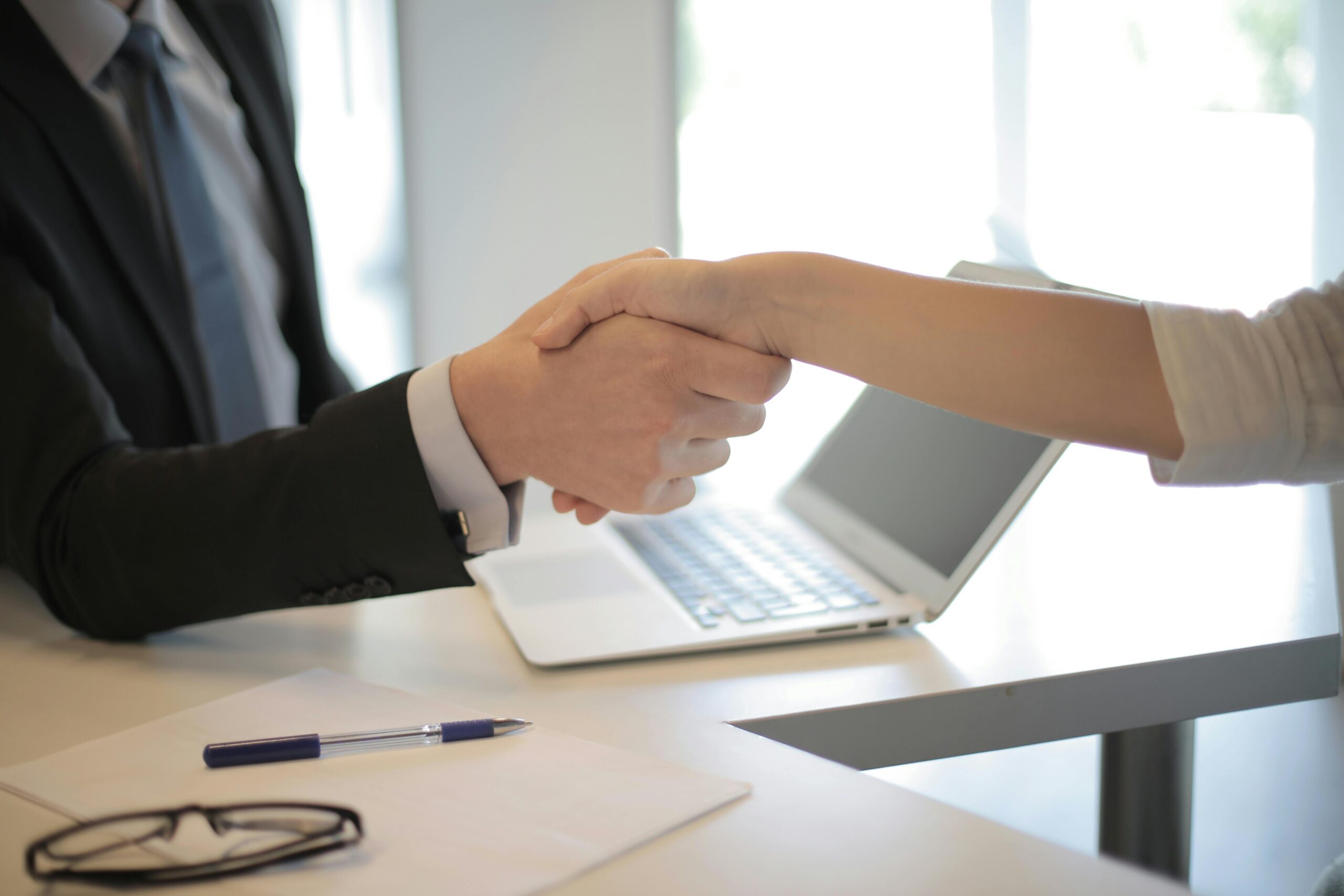 HANDSHAKE OVER A SUCCESSFUL DEAL