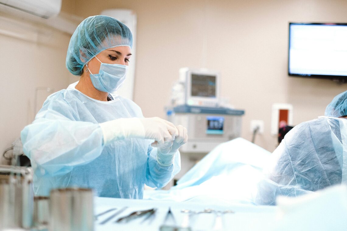 A nurse prepping patient for surgery