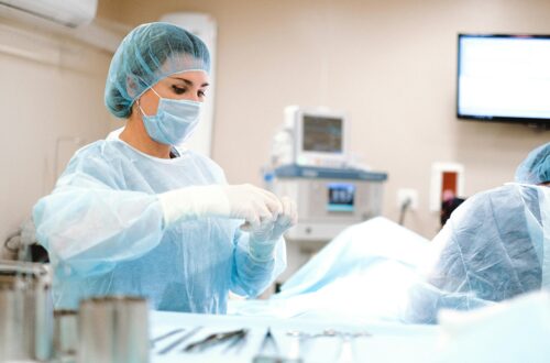 A nurse prepping patient for surgery