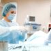 A nurse prepping patient for surgery