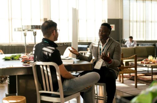 2 men discussing in an office