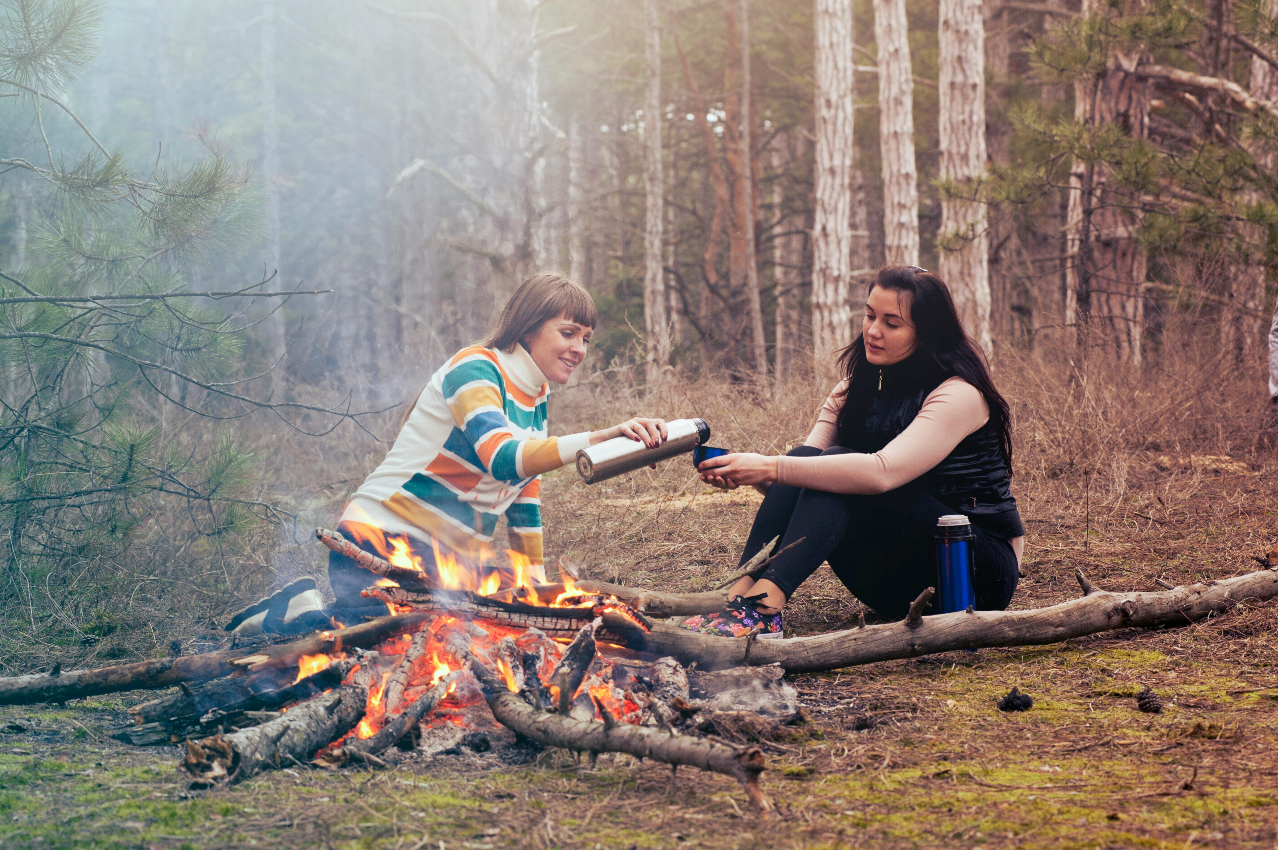 2 women camping in the woods