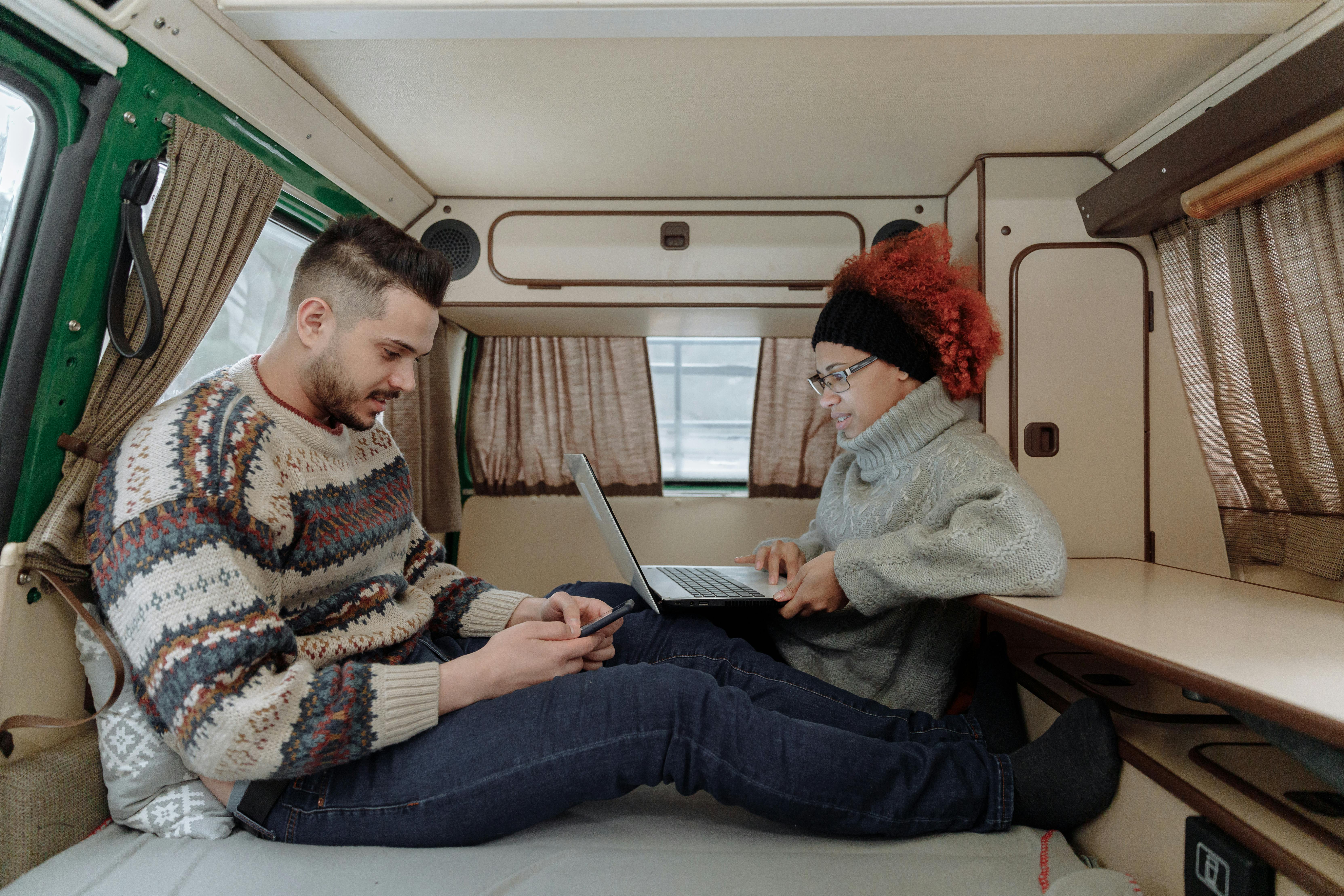 a couple conversing in their tent