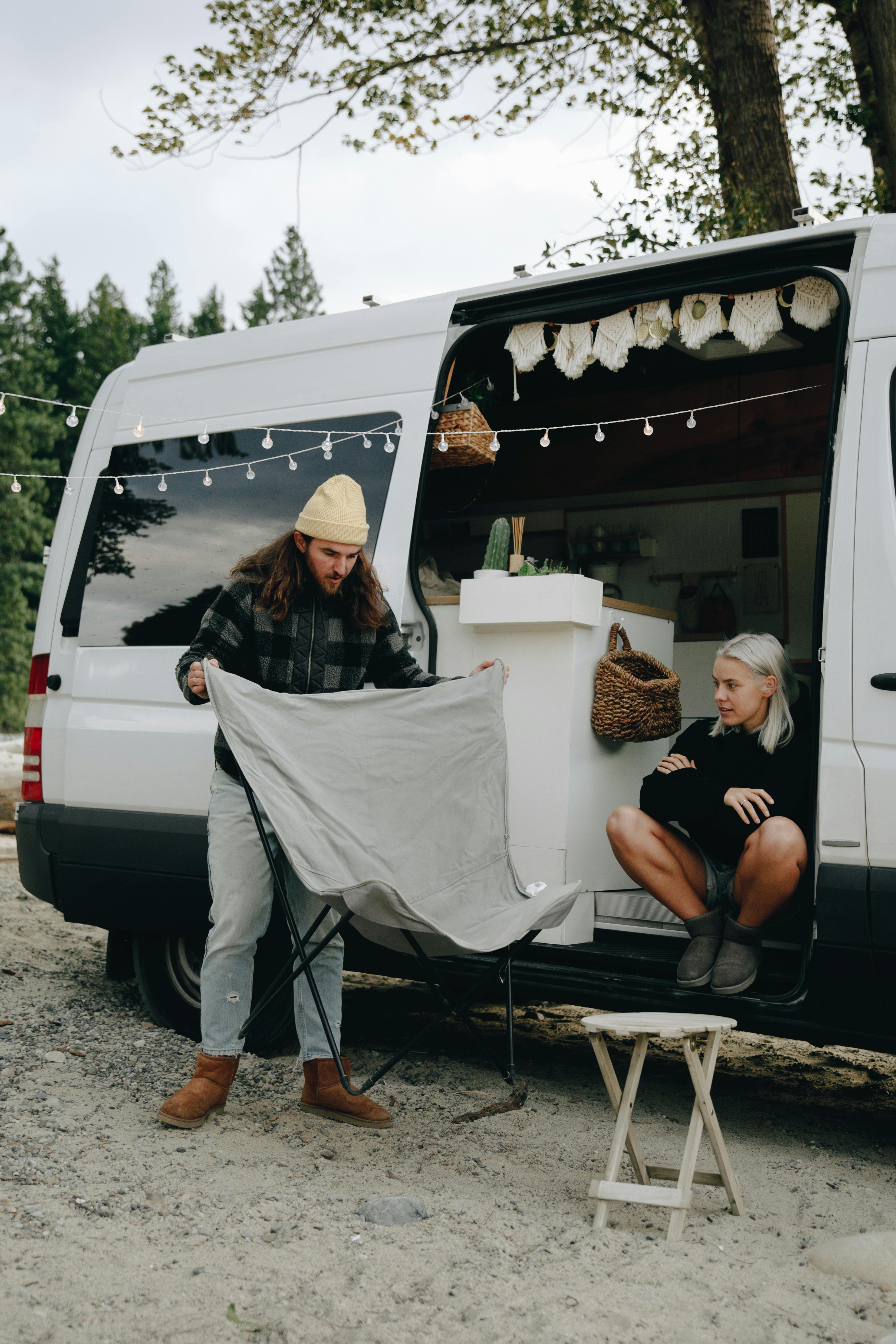 a couple hanging out in their van