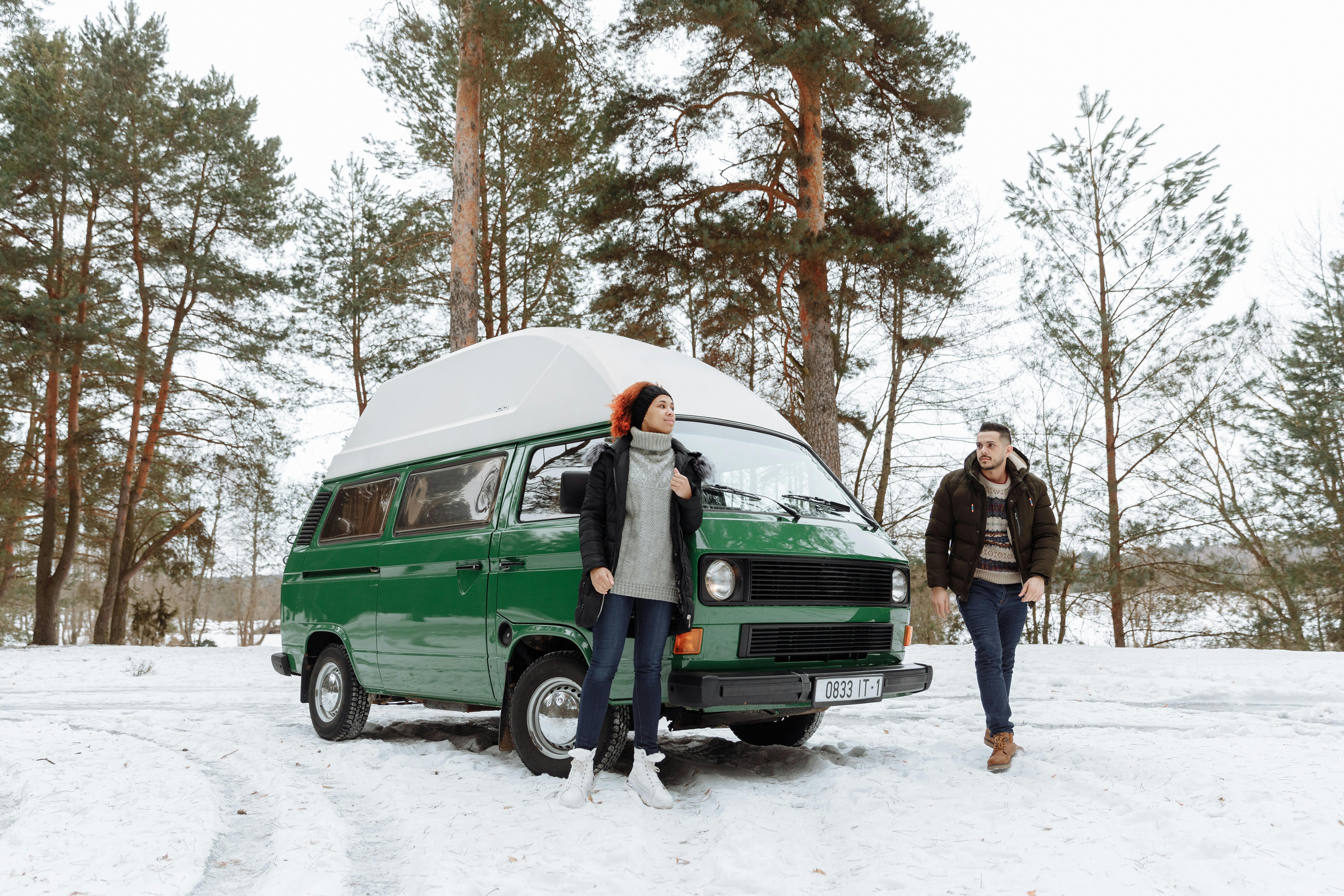 a couple in their green van