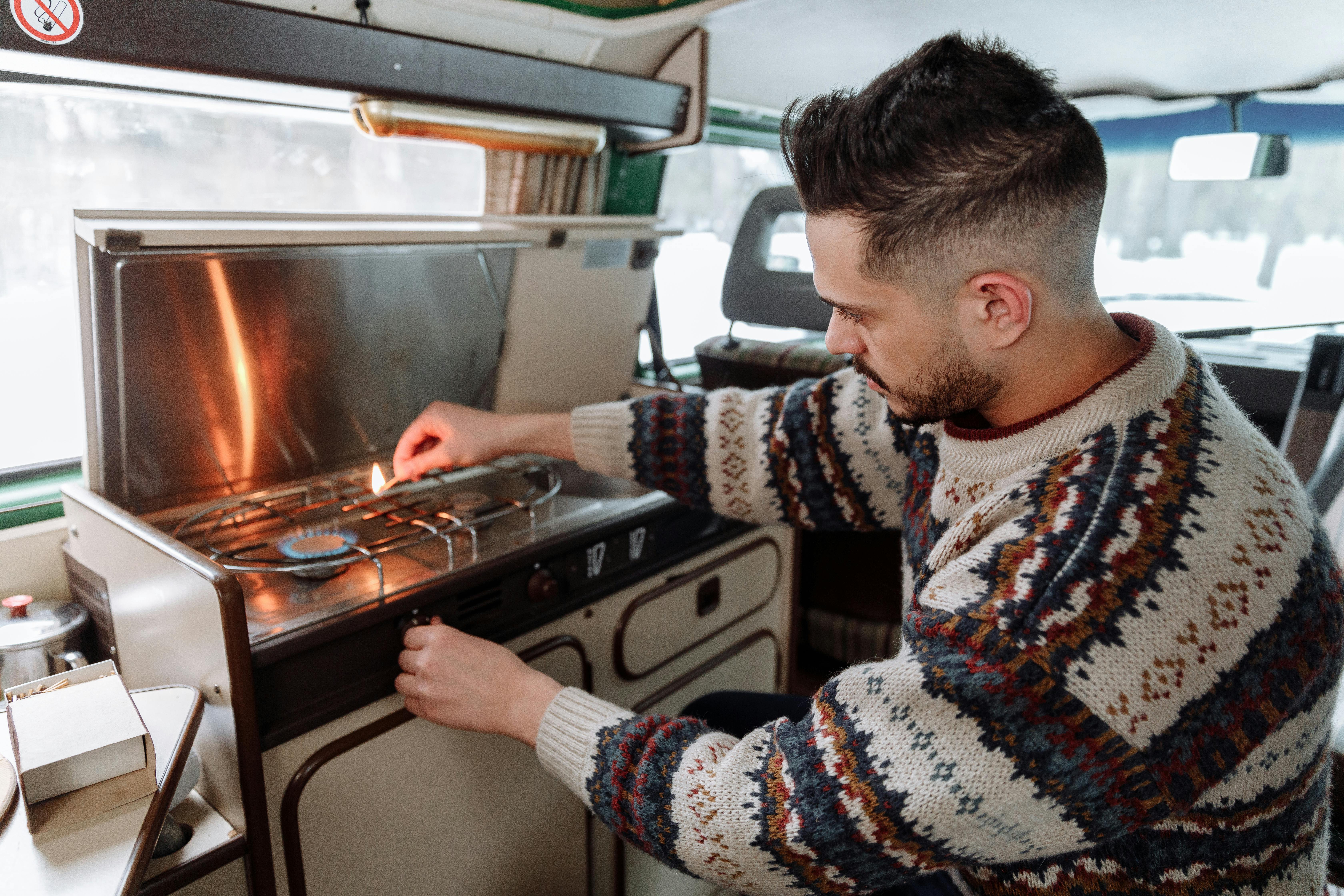 a man cooking in his van