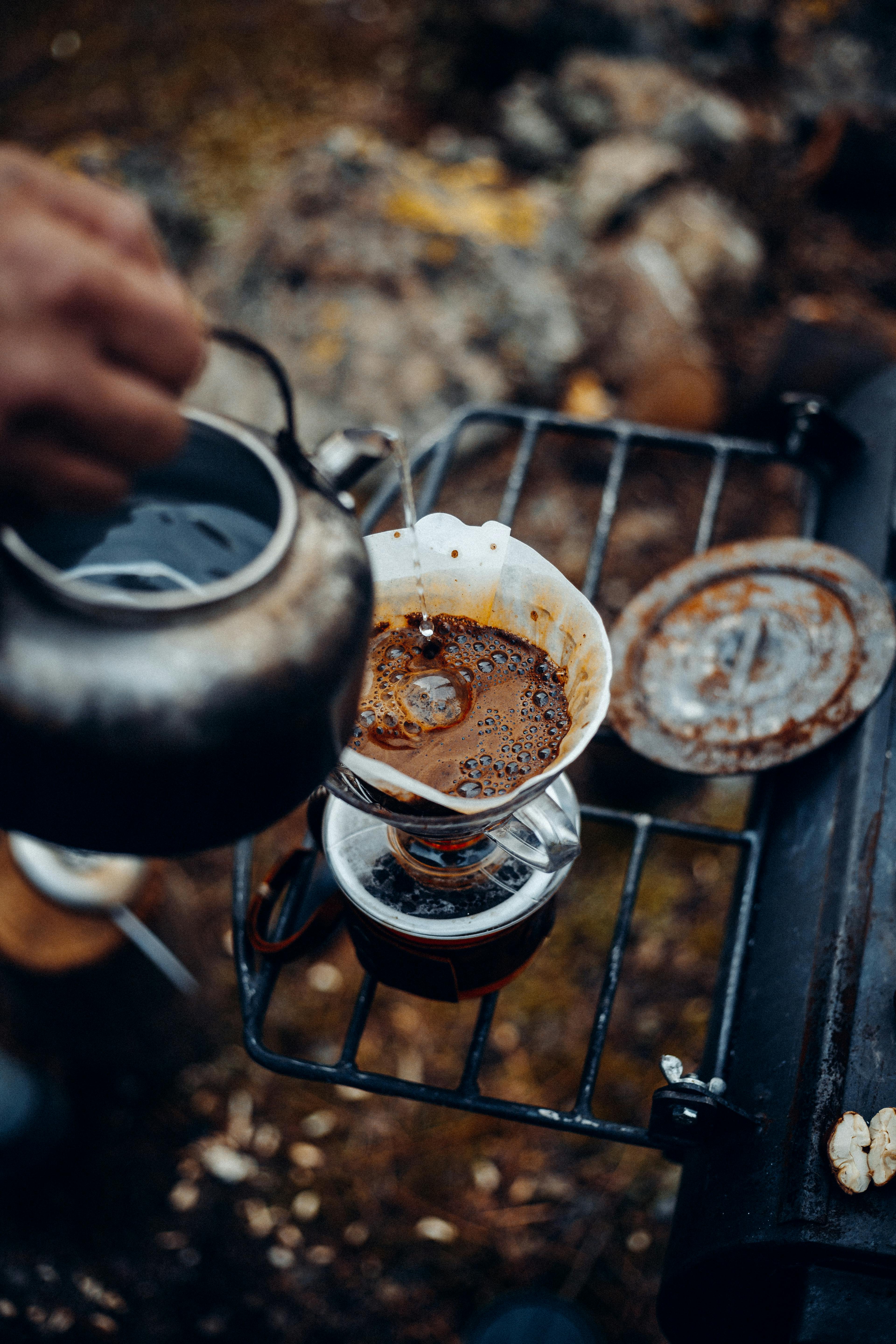 a van lifer making coffee outside his van