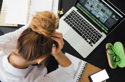 a woman searching for jobs on a laptop