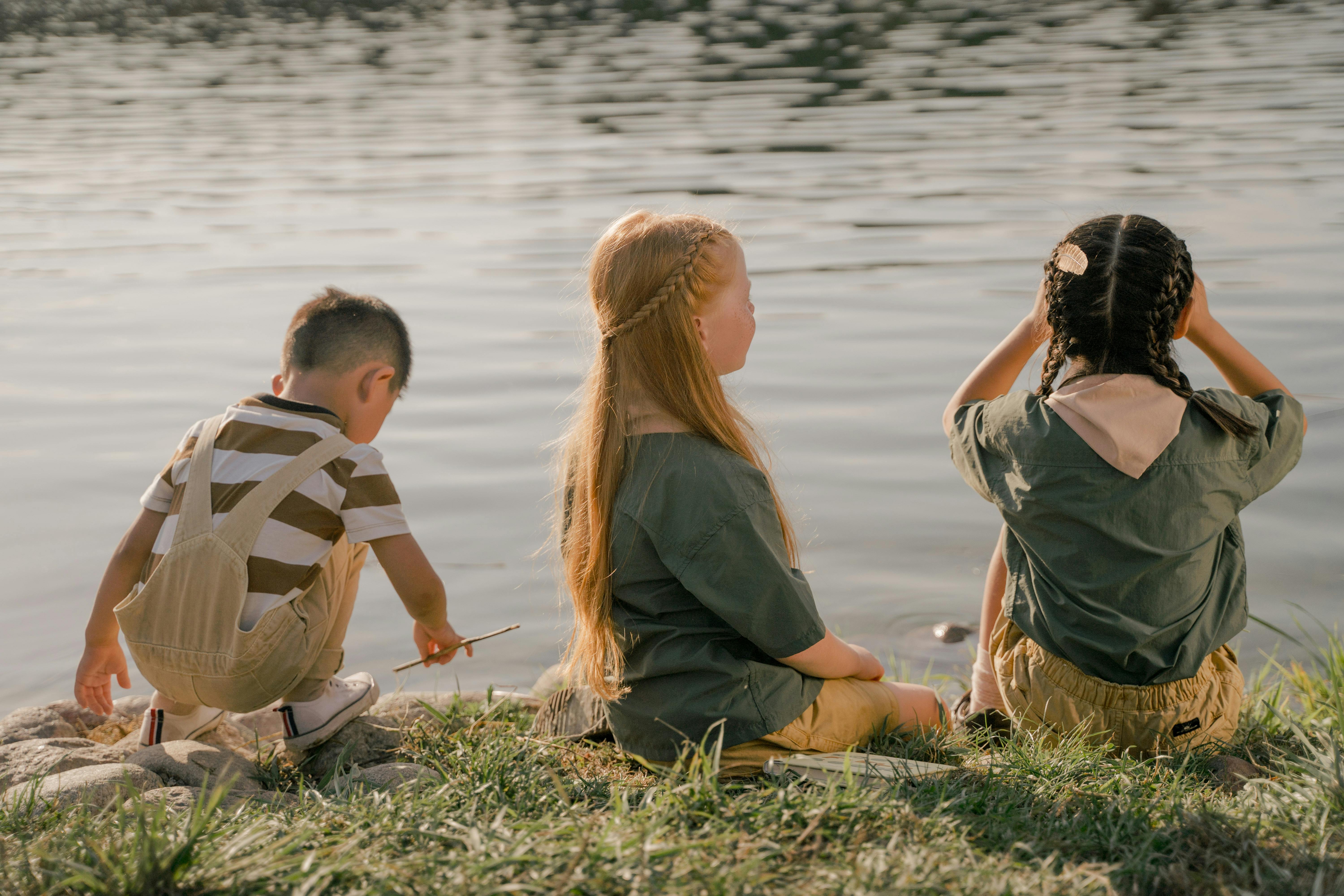 children camping by the river