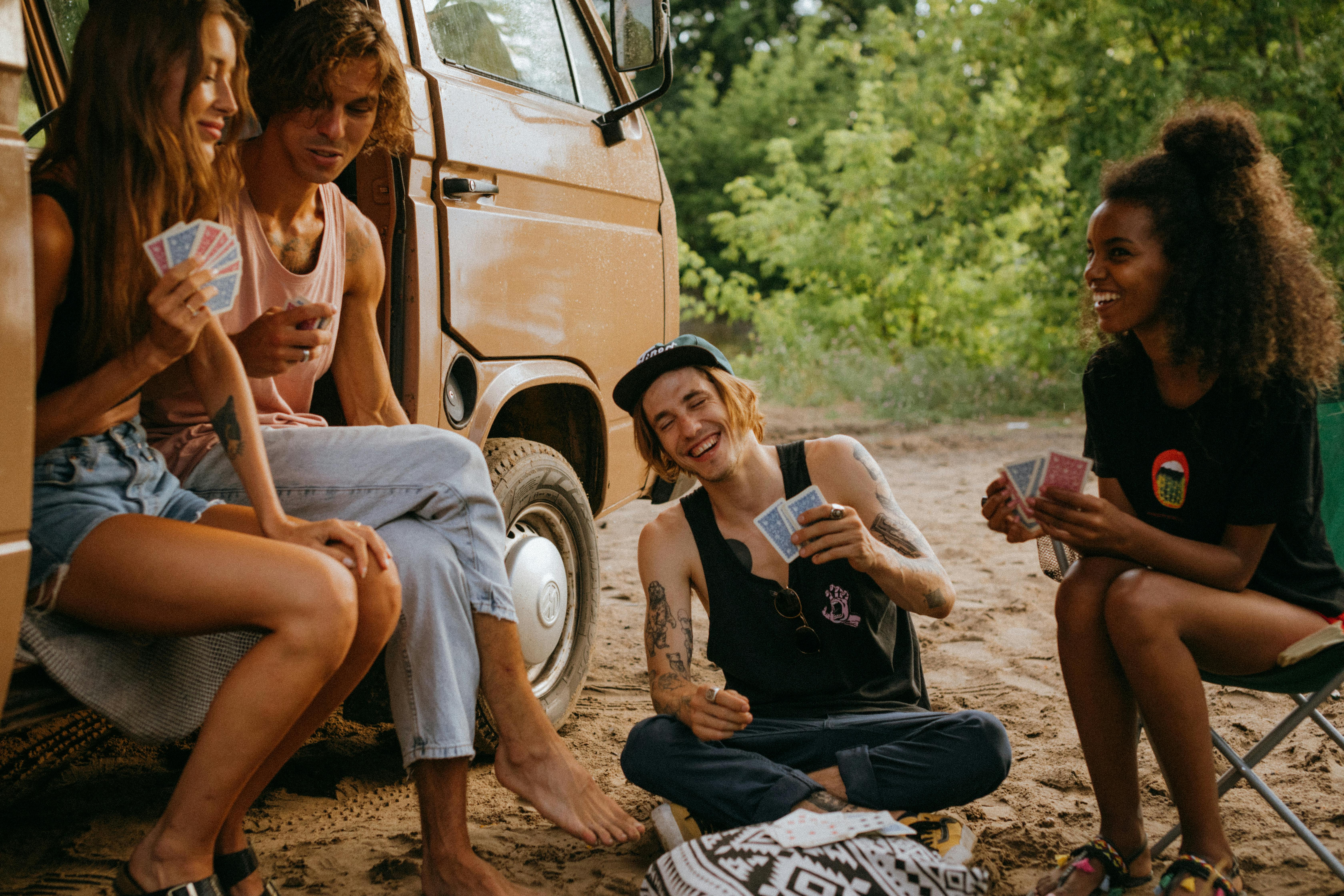 multiple friends camping in the woods