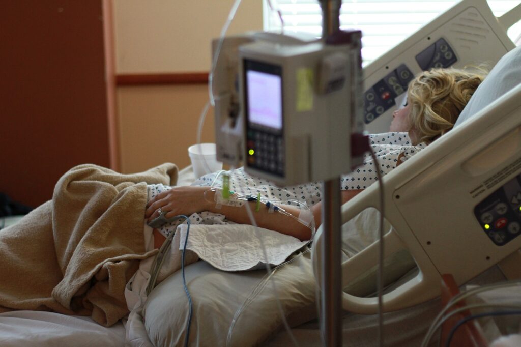 a woman in a hospital bed