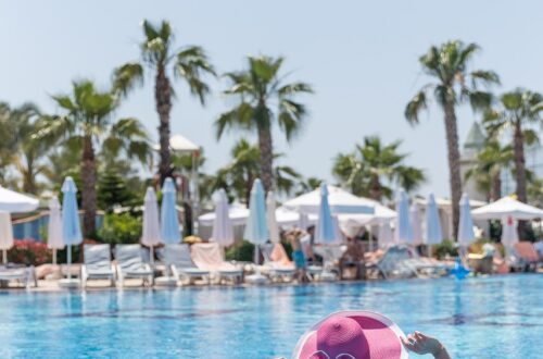 a woman lounging at the pool on holidays