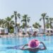 a woman lounging at the pool on holidays