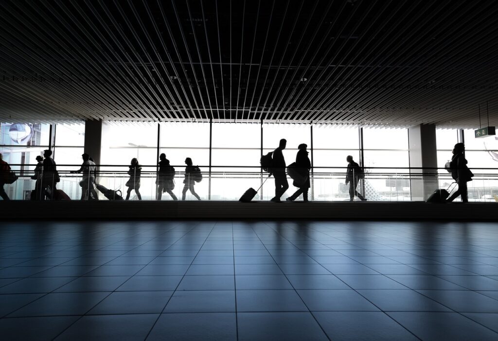 people walking around the airport