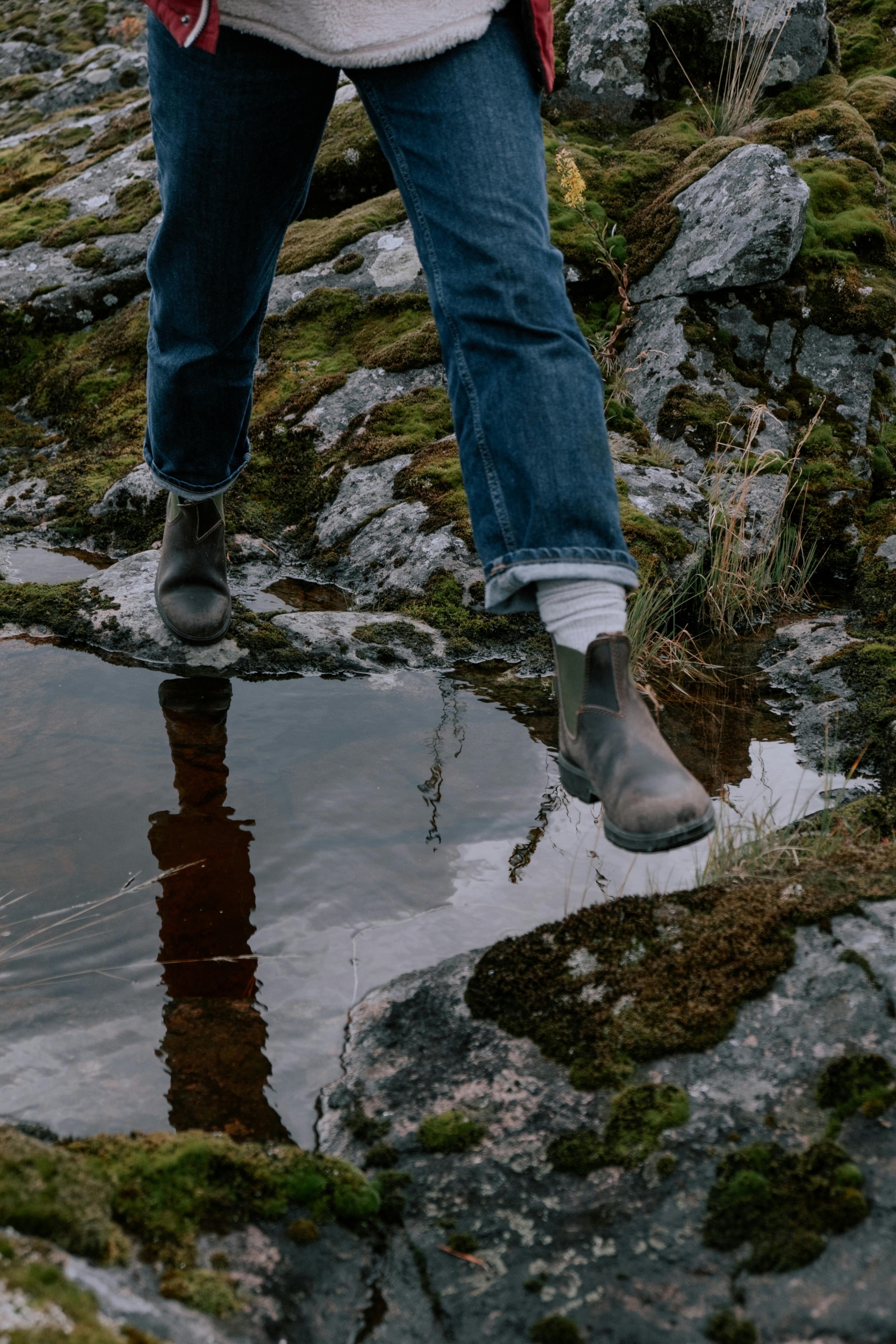 a man hiking in jeans